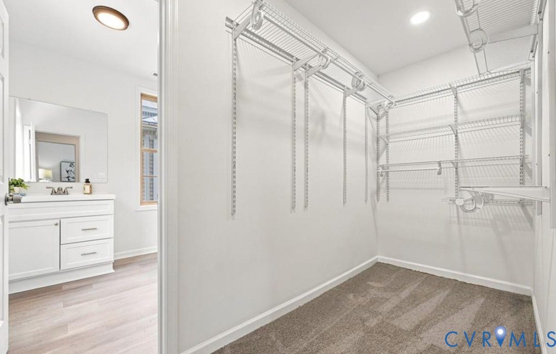104 E Fillmore Street, Petersburg, VA 23803 Walk-in closet with wire shelving system and carpet flooring