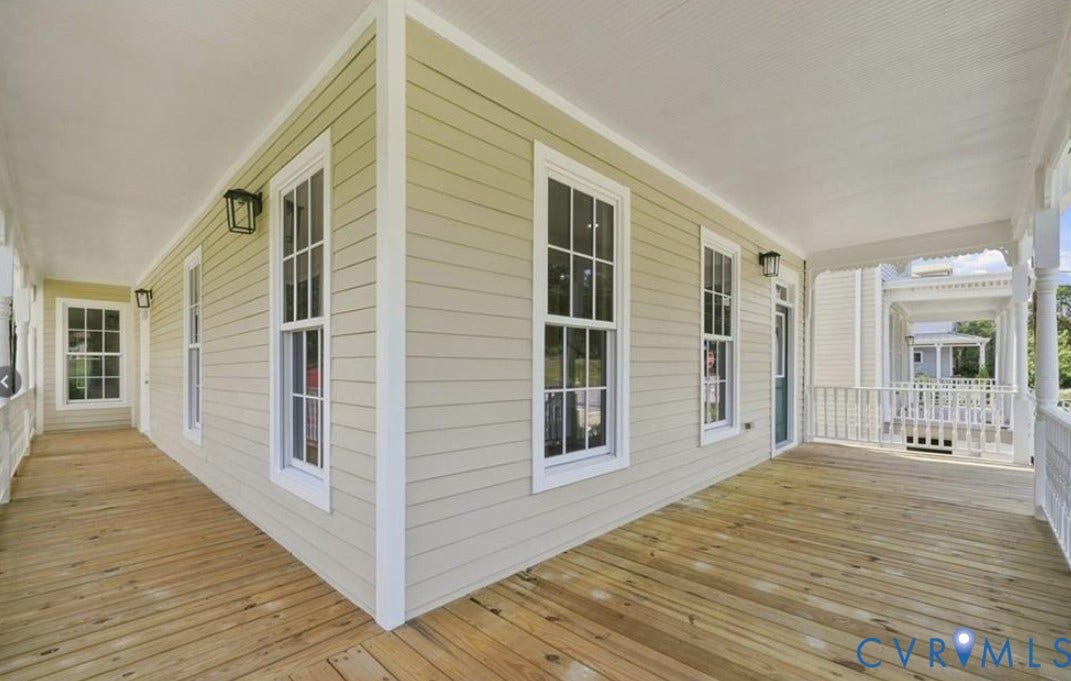 104 E Fillmore Street, Petersburg, VA 23803 Expansive porch featuring natural wood flooring, white railings, and decorative trim