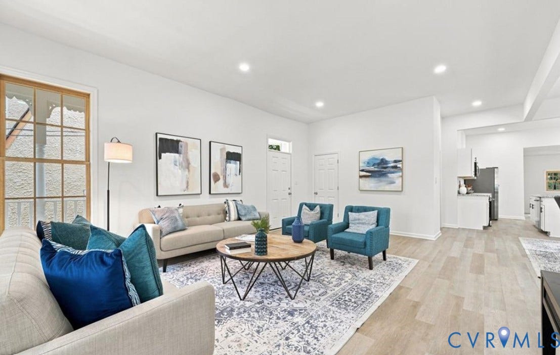 104 E Fillmore Street, Petersburg, VA 23803 Open-concept living space featuring wood-finish flooring, recessed lighting, and a large window with detailed trim