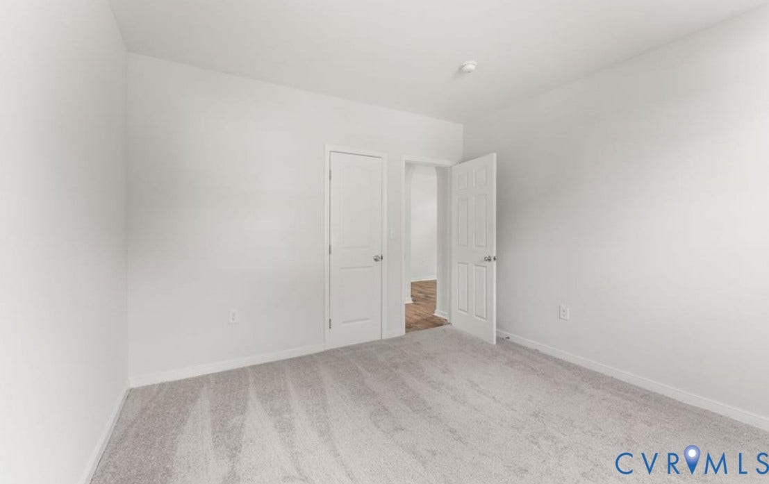 222 Elm Street, Petersburg, VA 23803 Neutral wall color, light-toned carpeting, and a flush-mount ceiling light