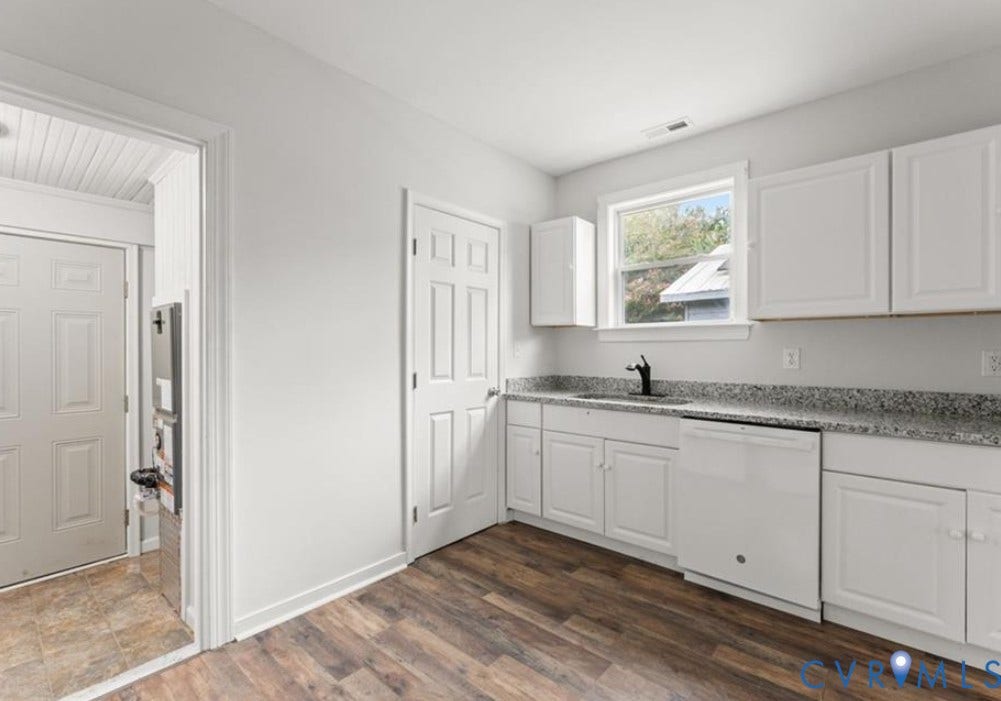 222 Elm Street, Petersburg, VA 23803 Kitchen featuring white cabinetry, a double basin sink with a matte black faucet, and a window above