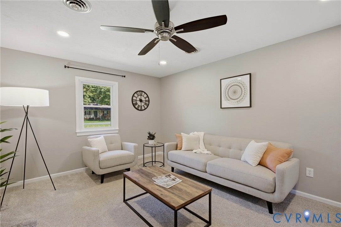 Recessed lighting, ceiling fan, neutral wall tones, window with white trim, and light-colored carpeting