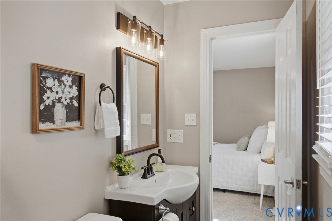 Dark wood-finish vanity with an integrated white sink