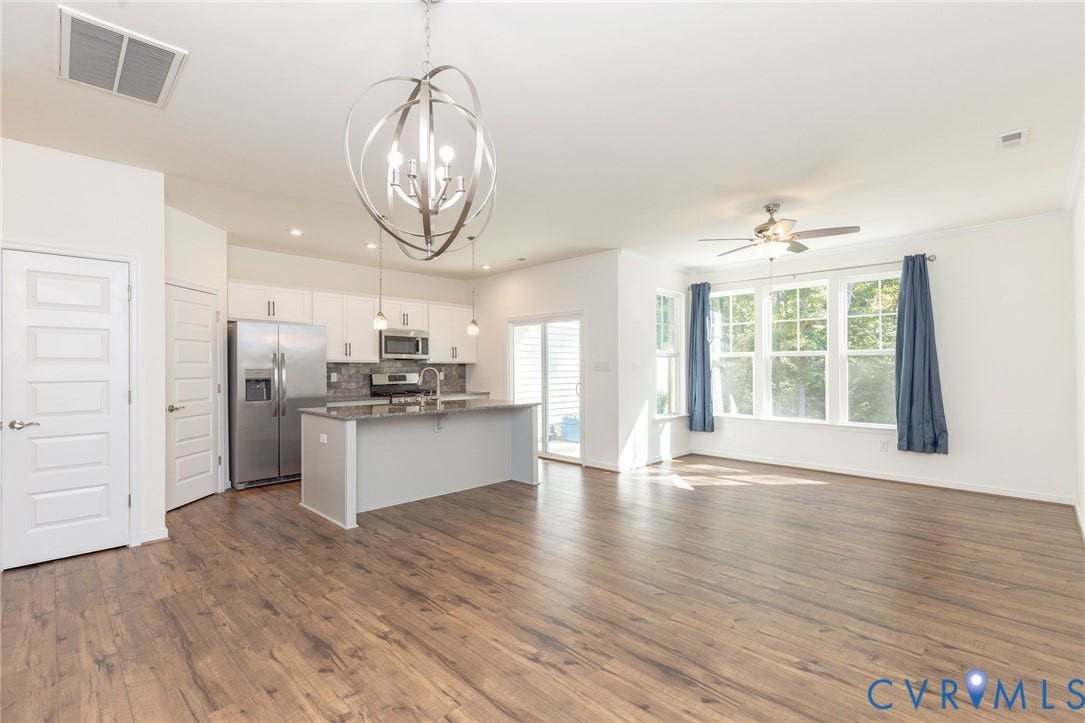 3625 Rainy Day Drive, Midlothian, Midlothian, VA 23112 Living room, kitchen, pantry, dining room, & access to patio