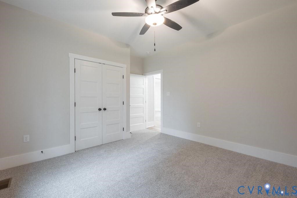 5301 Chimney Springs Drive, Goochland, VA 23063 Light-toned carpeted flooring paired with white trim