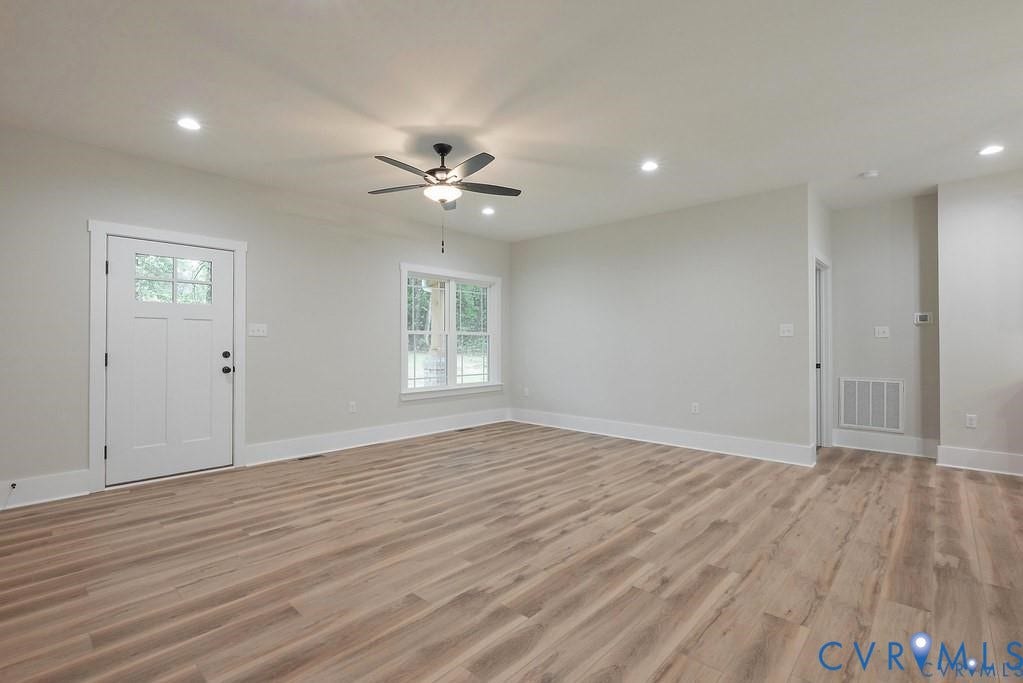 5301 Chimney Springs Drive, Goochland, VA 23063 Spacious interior featuring wood-finish flooring, recessed lighting, and a modern ceiling fan