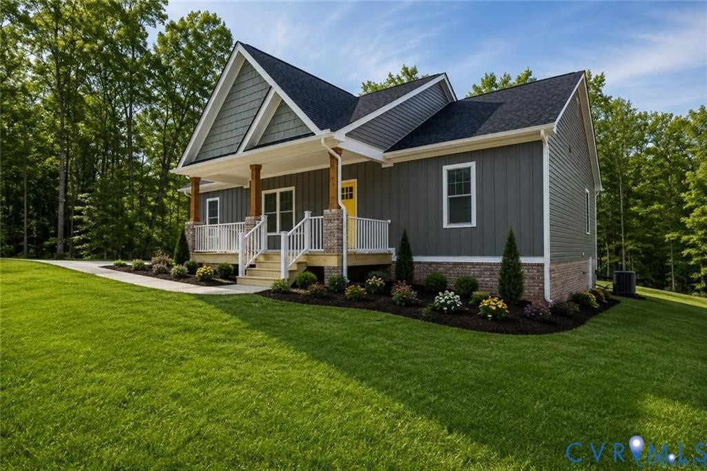 5301 Chimney Springs Drive, Goochland, VA 23063 Crafted with vertical and horizontal siding, a stone and brick foundation, a covered porch with wood columns, and a landscaped front yard