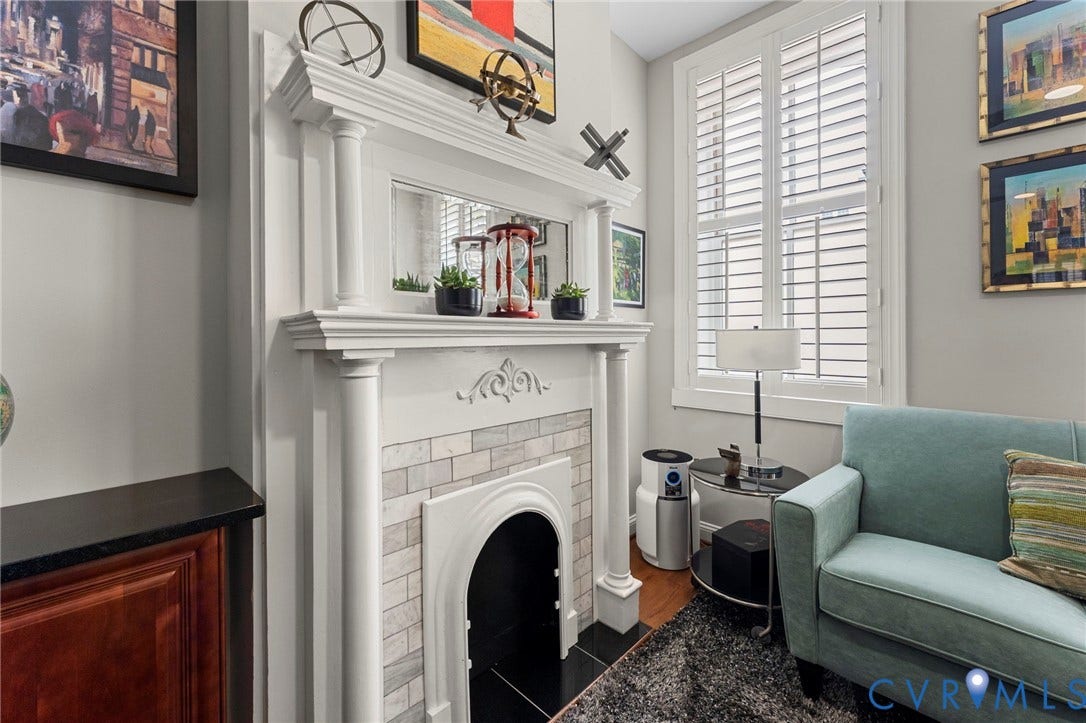 Decorative fireplace mantel with fluted columns and detailed corbels