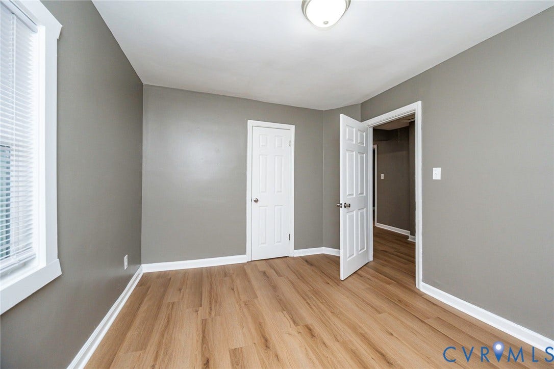 634 Fayette Avenue, Richmond, VA 23222 Wood-finish flooring, white trim, window with blinds, paneled interior doors, and a flush mount light fixture