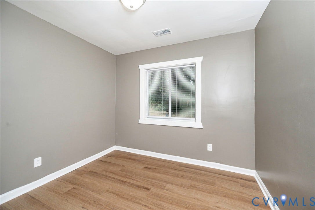 634 Fayette Avenue, Richmond, VA 23222 Neutral paint palette with wood-finish flooring and white trim