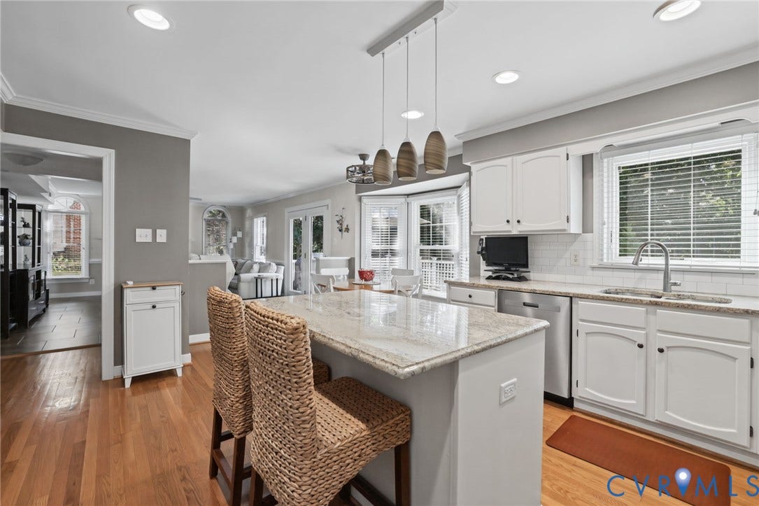 Kitchen featuring a central island with countertop seating