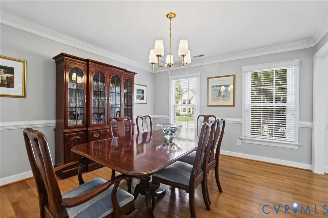 Hardwood-finish flooring with crisp white crown molding