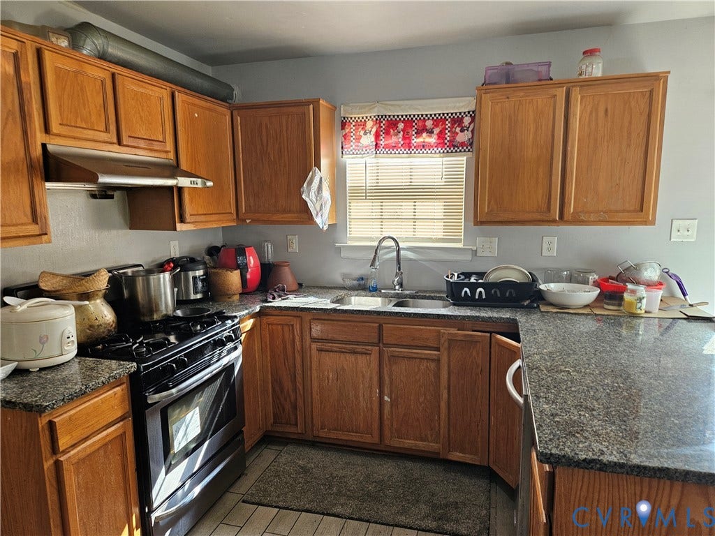 1307 Spruance Road, Outten Woods, Richmond, VA 23225 U-shaped kitchen featuring wood cabinetry, granite-style countertops, a stainless steel range hood, and a built-in oven with a gas cooktop
