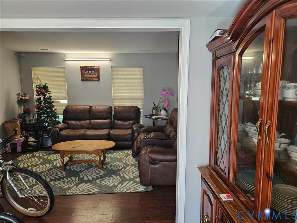 1307 Spruance Road, Outten Woods, Richmond, VA 23225 Hardwood-finish flooring, light gray wall color, and white trim molding contribute to the interior aesthetic