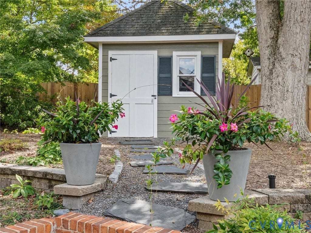 7723 Stuart Hall Road, Rollingwood Terrace, Henrico, VA 23229 Gabled roof structure featuring a window with shutters and double doors