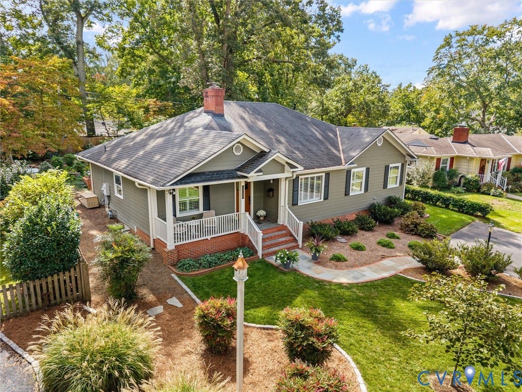 7723 Stuart Hall Road, Rollingwood Terrace, Henrico, VA 23229 Siding exterior with contrasting shutters, covered front porch, brick steps, front yard with mature landscaping, and an extended driveway