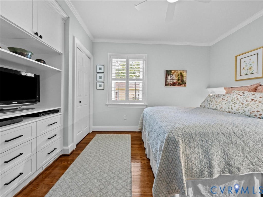 7723 Stuart Hall Road, Rollingwood Terrace, Henrico, VA 23229 Built-in cabinetry with shelving and drawers, wood-finish flooring, plantation shutters, crown molding, and a ceiling fan
