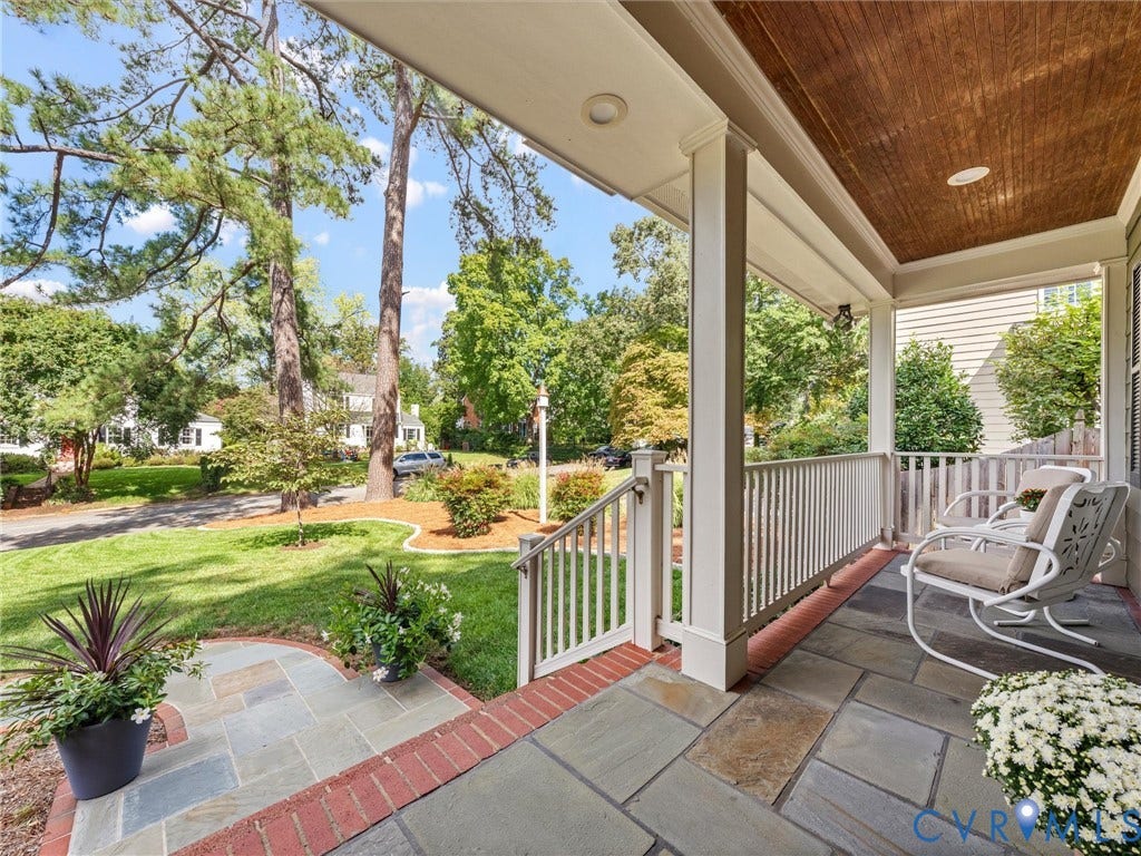 7723 Stuart Hall Road, Rollingwood Terrace, Henrico, VA 23229 Covered front porch featuring flagstone flooring, white railing, and a wood-paneled ceiling