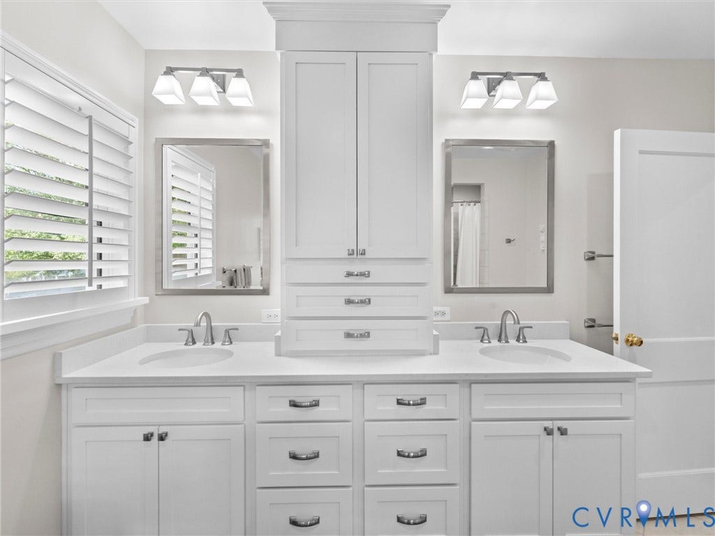 7723 Stuart Hall Road, Rollingwood Terrace, Henrico, VA 23229 Dual vanity with white cabinetry and integrated sinks