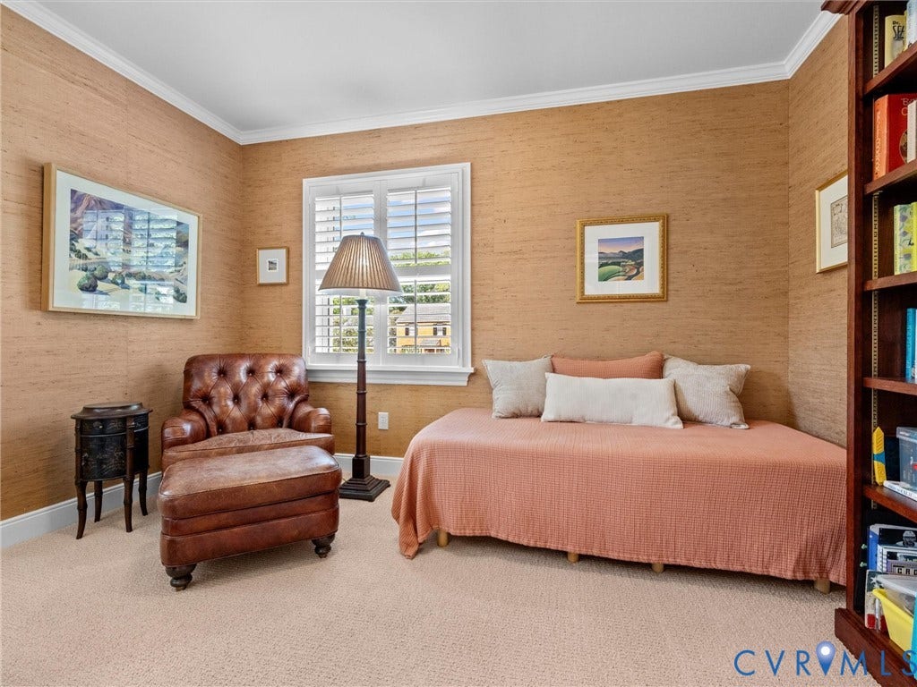 7723 Stuart Hall Road, Rollingwood Terrace, Henrico, VA 23229 Crown molding, textured wall coverings, plantation shutters, and light-toned carpeting