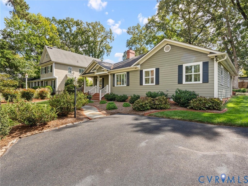 7723 Stuart Hall Road, Rollingwood Terrace, Henrico, VA 23229 Siding exterior with black shutters, mature landscaping, paved driveway, and covered entry porch with white railings