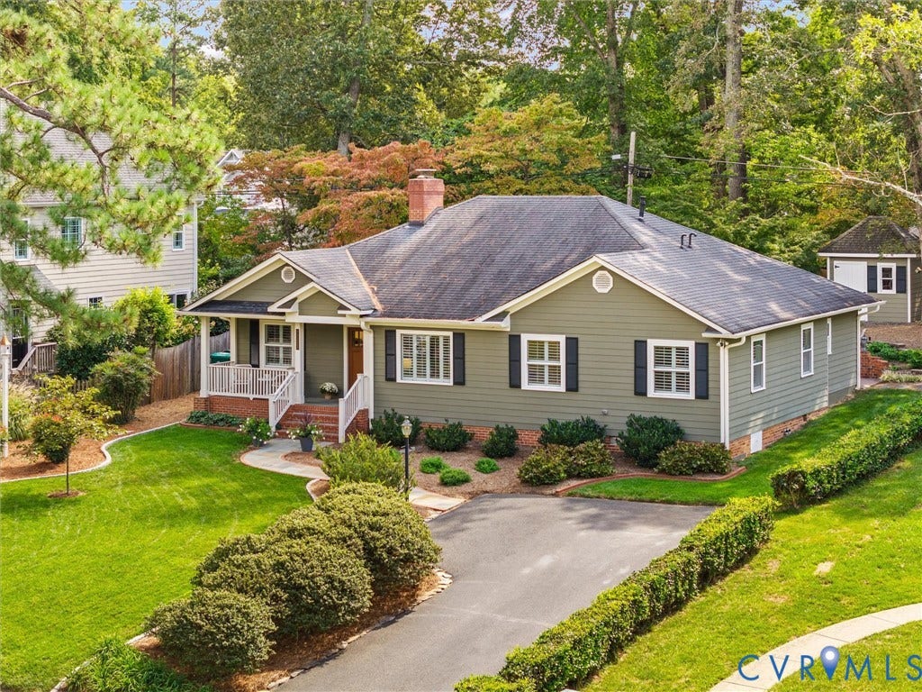 7723 Stuart Hall Road, Rollingwood Terrace, Henrico, VA 23229 Expansive lawn with mature trees, paved driveway, covered front porch, and a detached outbuilding