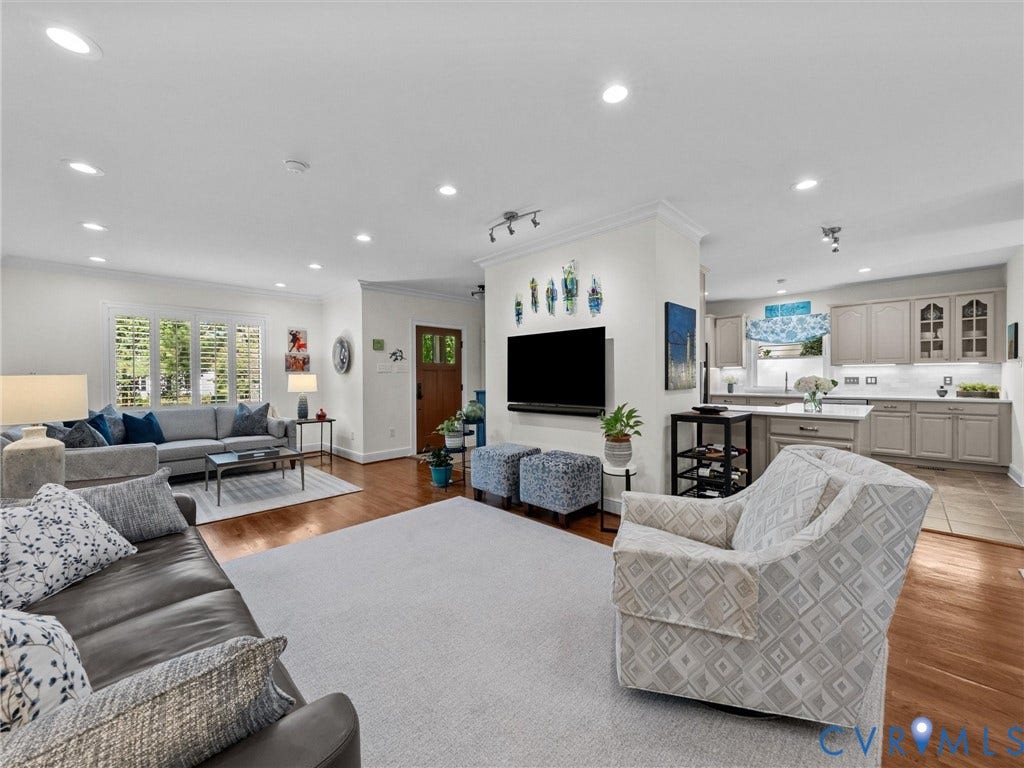 7723 Stuart Hall Road, Rollingwood Terrace, Henrico, VA 23229 Recessed lighting, wood-finish flooring, white plantation shutters, built-in kitchen cabinetry, and a kitchen island with seating