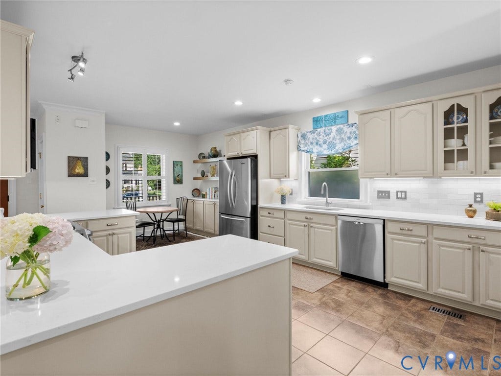 7723 Stuart Hall Road, Rollingwood Terrace, Henrico, VA 23229 Kitchen with light-toned cabinetry, stainless steel appliances, white countertops, and tiled flooring