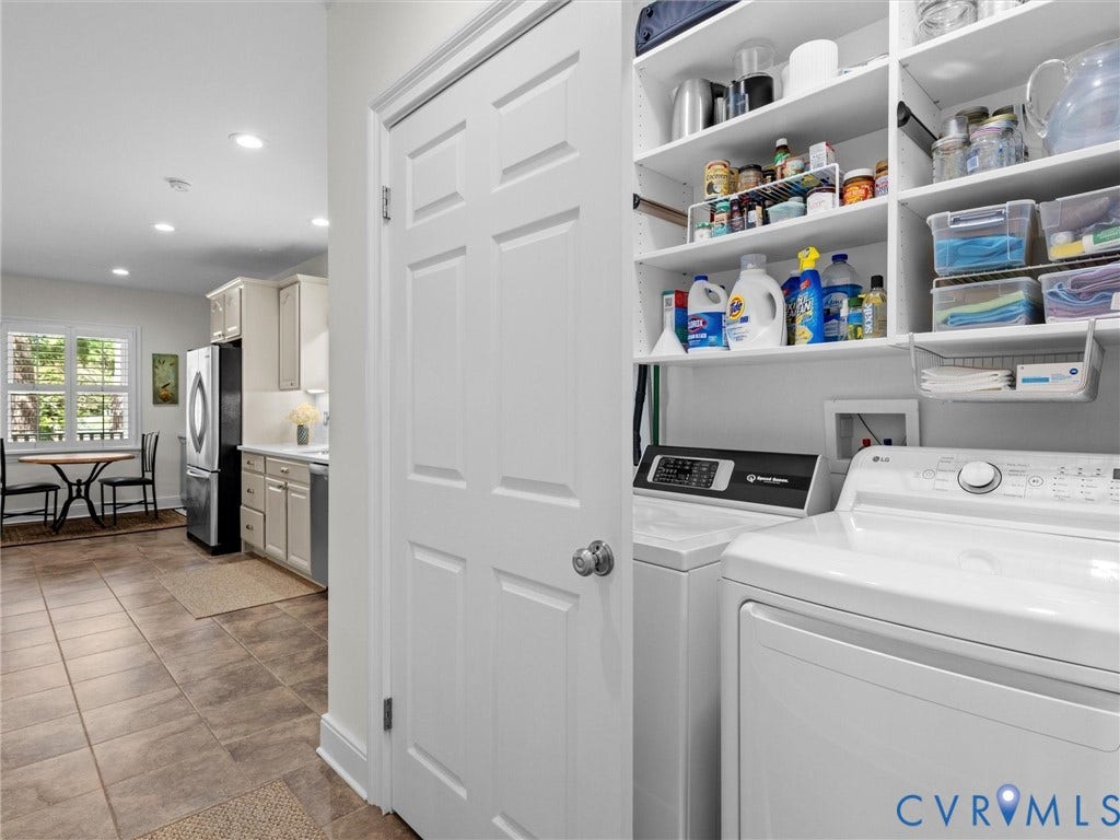 7723 Stuart Hall Road, Rollingwood Terrace, Henrico, VA 23229 Laundry area featuring built-in shelving, a full-size washer, and a full-size dryer