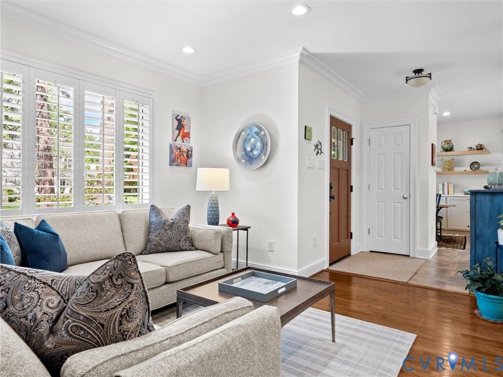 7723 Stuart Hall Road, Rollingwood Terrace, Henrico, VA 23229 White plantation shutters, recessed lighting, crown molding, wood-finish flooring, and a paneled entry door