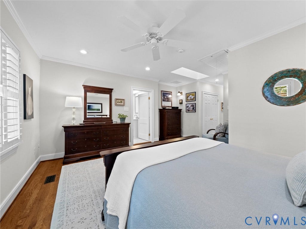 7723 Stuart Hall Road, Rollingwood Terrace, Henrico, VA 23229 Hardwood flooring, recessed lighting, ceiling fan, crown molding, and window shutters