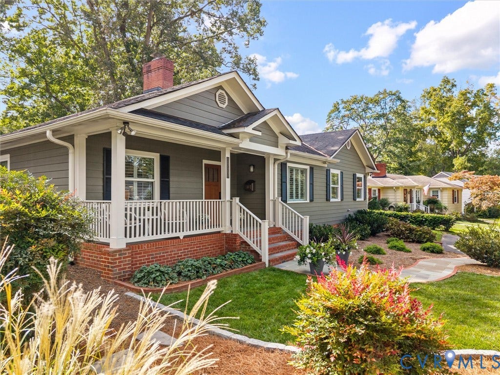 7723 Stuart Hall Road, Rollingwood Terrace, Henrico, VA 23229 Gable-roof residence featuring horizontal siding, a covered front porch with white railings, and a brick foundation