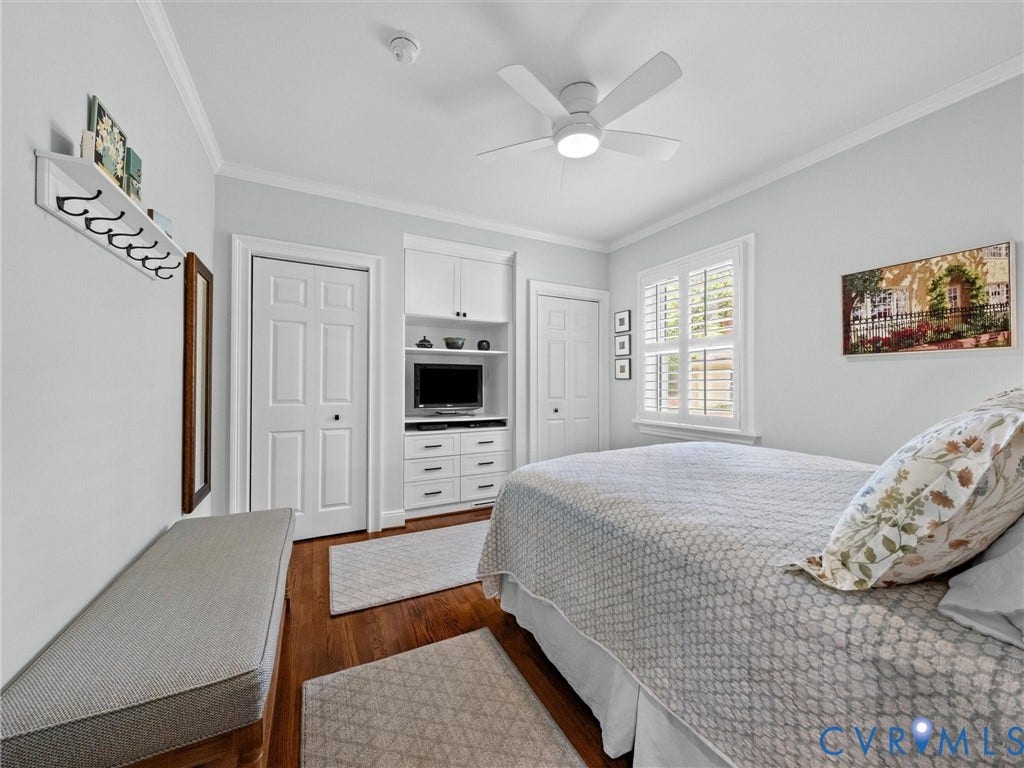 7723 Stuart Hall Road, Rollingwood Terrace, Henrico, VA 23229 Wood-finish flooring, plantation shutters, crown molding, built-in cabinetry with drawers, and a ceiling fan with integrated lighting