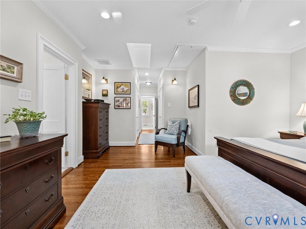 7723 Stuart Hall Road, Rollingwood Terrace, Henrico, VA 23229 Hardwood flooring, recessed lighting, crown molding, ceiling fan, and wall sconces