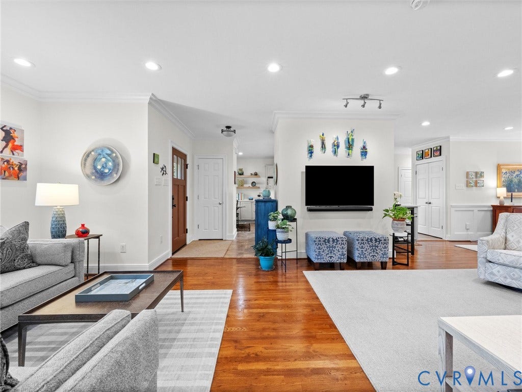 7723 Stuart Hall Road, Rollingwood Terrace, Henrico, VA 23229 Recessed lighting illuminates the living space with wood-finish flooring