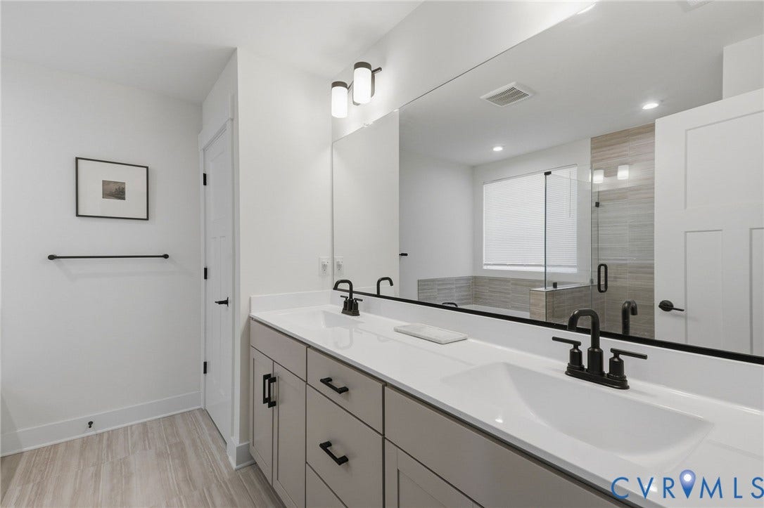 6142 Jackline Run, Watermark, Chesterfield, VA 23234 Dual vanity with white countertops, undermount sinks, and matte black fixtures