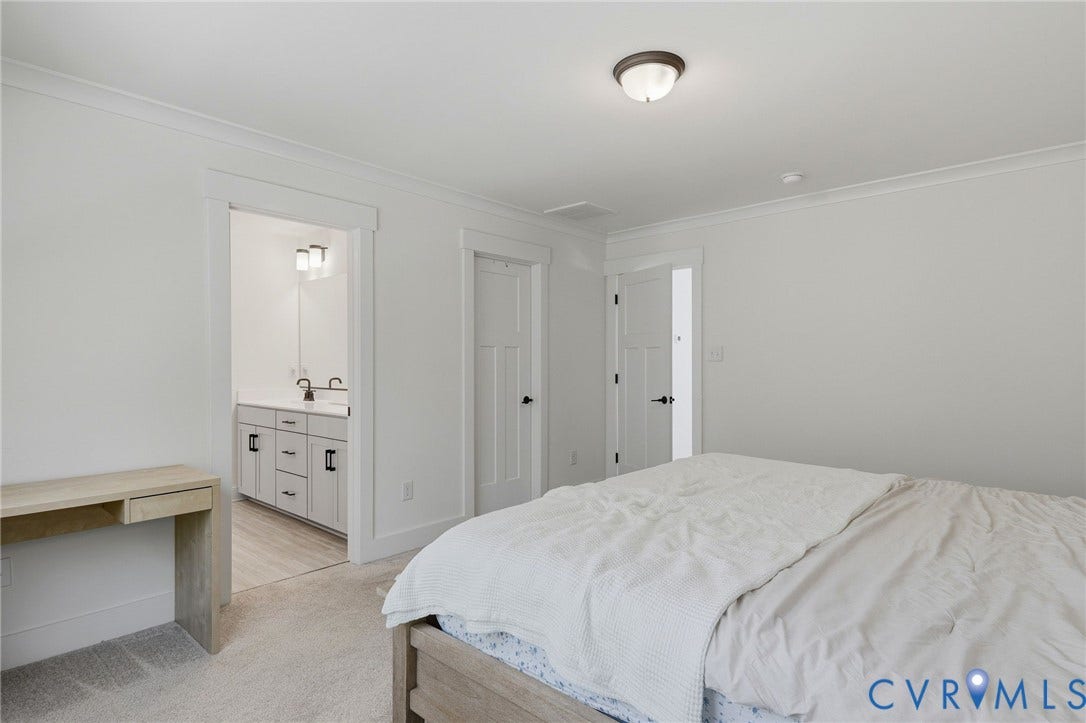 6142 Jackline Run, Watermark, Chesterfield, VA 23234 White walls with crown molding, ceiling-mounted light fixture, and light-toned carpet flooring