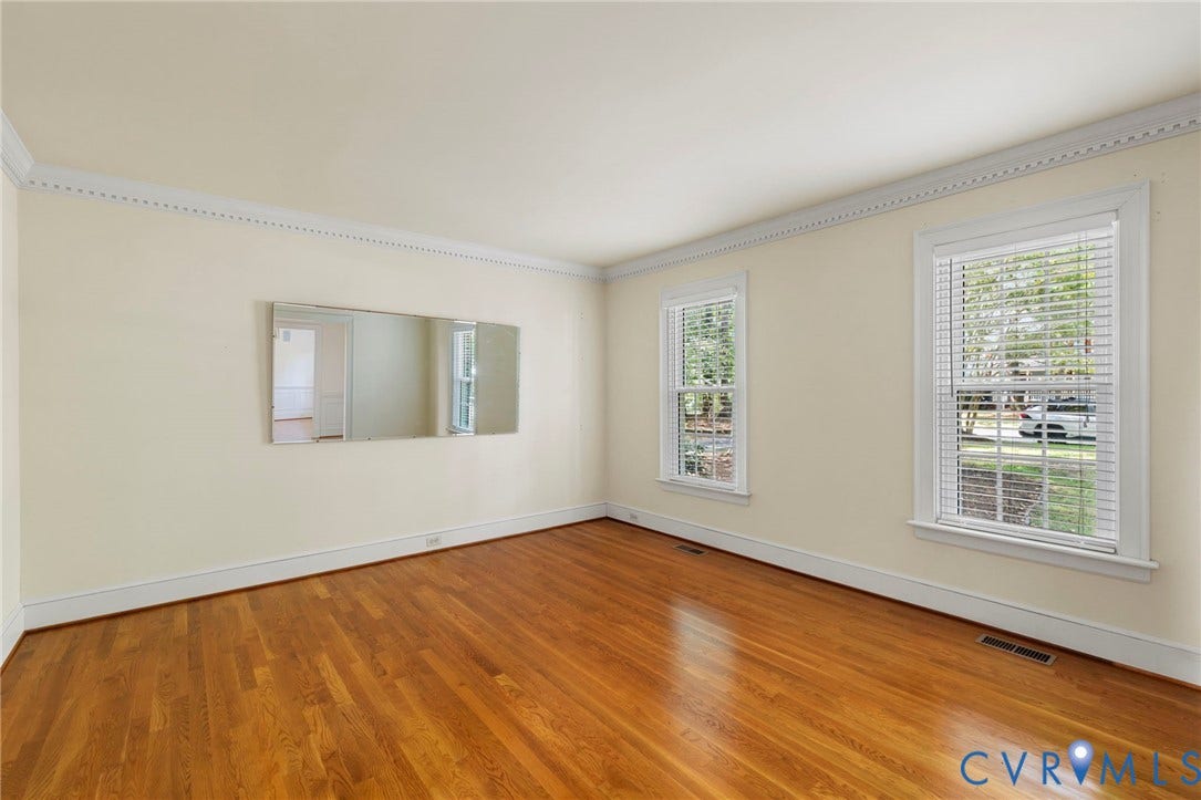 Wood-finish flooring paired with light-toned walls