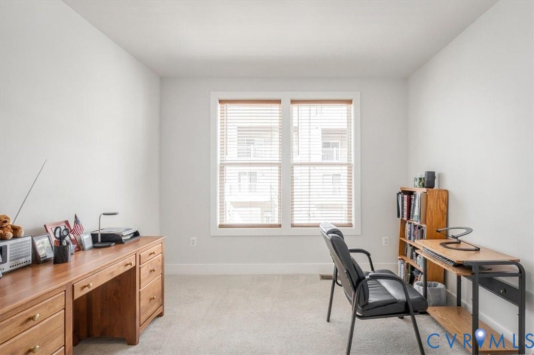9690 Turning Point Dr, #A, 4E300, Glen Allen, VA 23059 Light-filled room featuring neutral wall paint, carpet flooring, and a double window with blinds