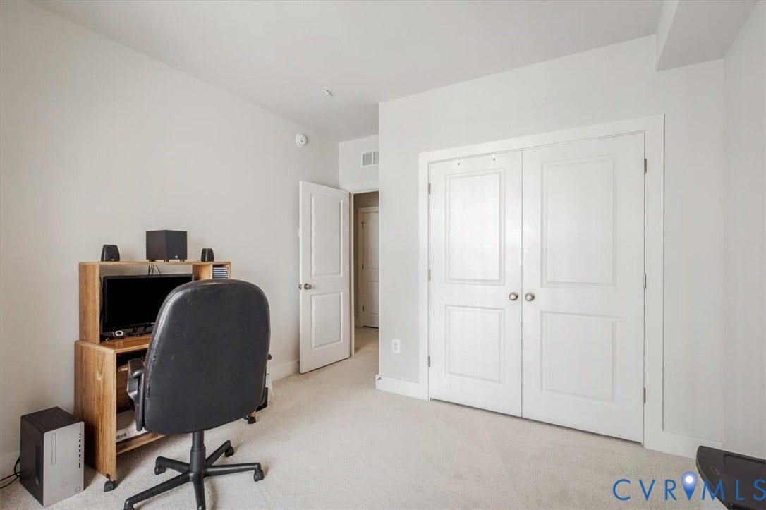 9690 Turning Point Dr, #A, 4E300, Glen Allen, VA 23059 White paneled double doors with round hardware, light-colored carpeting, and light gray wall paint