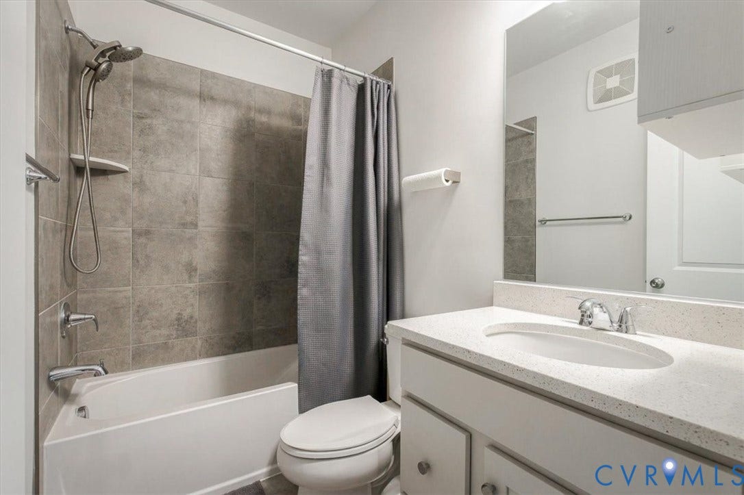 9690 Turning Point Dr, #A, 4E300, Glen Allen, VA 23059 White vanity with a light-toned countertop, chrome-finish faucet, and an undermount sink