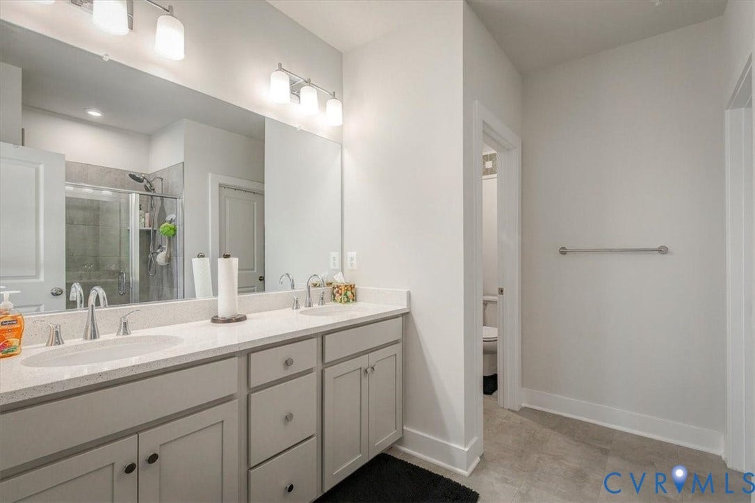 9690 Turning Point Dr, #A, 4E300, Glen Allen, VA 23059 Dual vanity with light-toned countertop, under-mount sinks, and chrome faucets