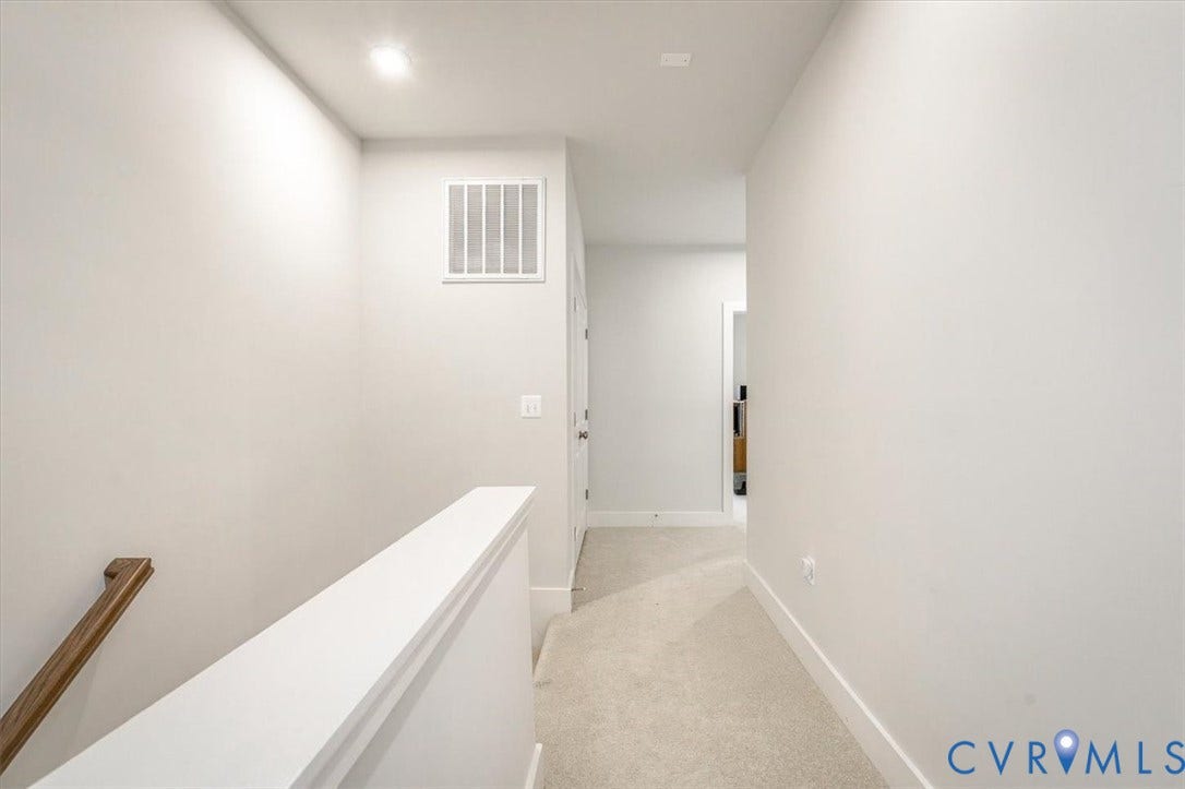 9690 Turning Point Dr, #A, 4E300, Glen Allen, VA 23059 Hallway featuring light-colored carpeting, white walls, recessed ceiling lighting, and a wood handrail