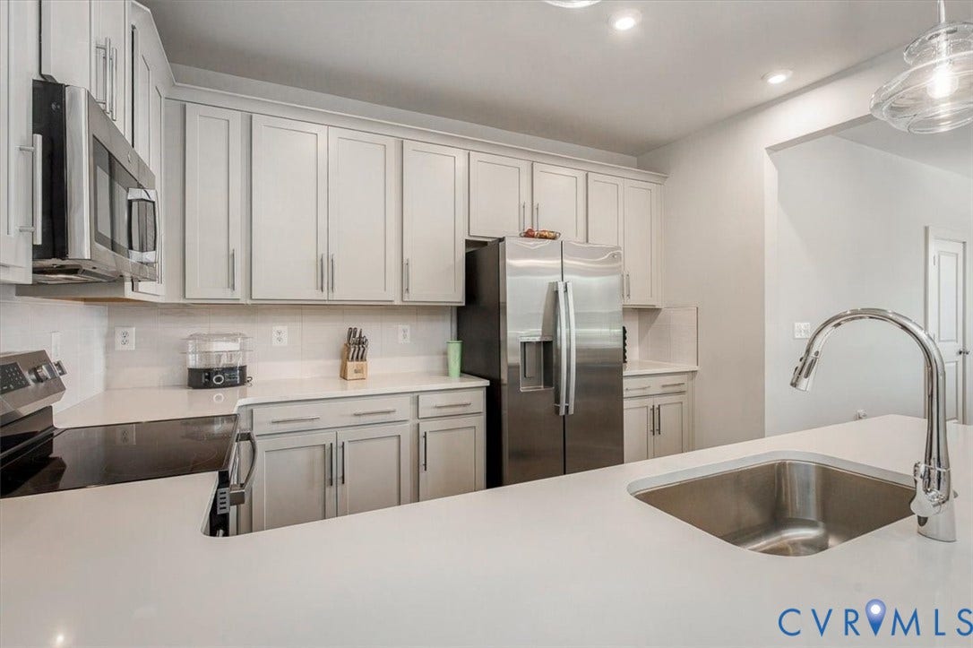 9690 Turning Point Dr, #A, 4E300, Glen Allen, VA 23059 Kitchen featuring light-toned cabinetry, stainless steel appliances, white countertops, and a stainless steel undermount sink with a gooseneck faucet