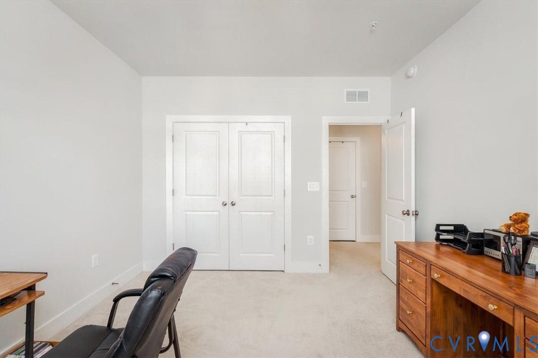 9690 Turning Point Dr, #A, 4E300, Glen Allen, VA 23059 White paneled closet doors, neutral wall paint, and light-colored carpeting