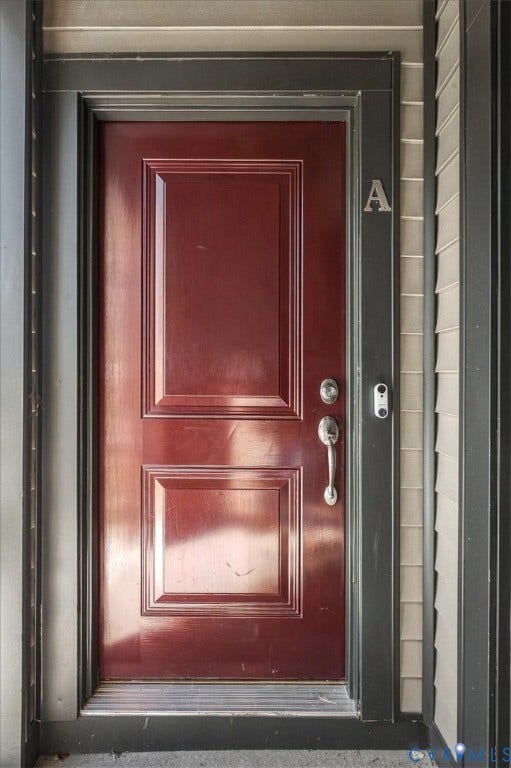 9690 Turning Point Dr, #A, 4E300, Glen Allen, VA 23059 Panel door with a rich finish, polished door hardware, dark trim, and horizontal siding