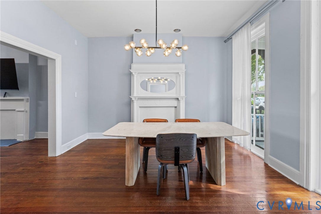 724 N 1st Street, Jackson Ward, Richmond, VA 23219 Hardwood flooring, decorative fireplace mantel with mirror, contemporary chandelier, and French doors