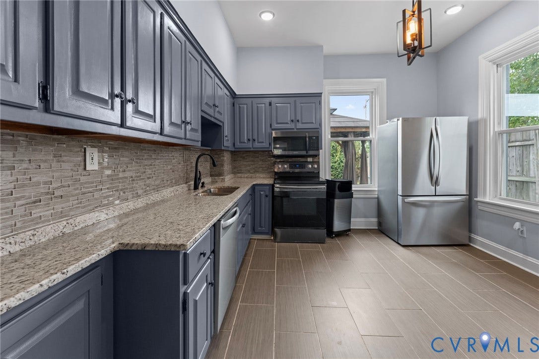 724 N 1st Street, Jackson Ward, Richmond, VA 23219 Kitchen with gray shaker-style cabinetry, mosaic tile backsplash, light-toned countertops, tile flooring, and recessed lighting