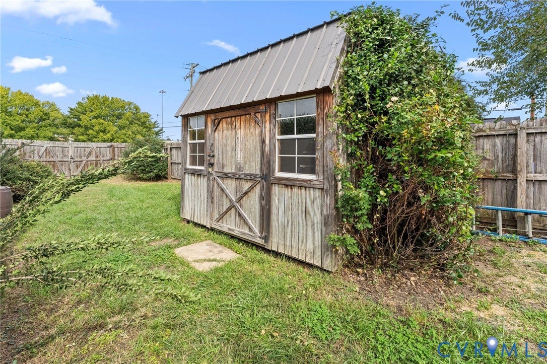 724 N 1st Street, Jackson Ward, Richmond, VA 23219 Freestanding wood-sided shed with a metal roof