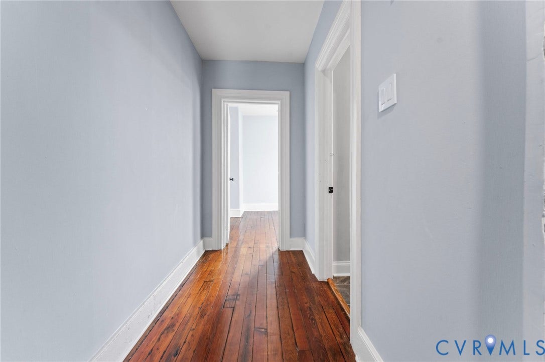 724 N 1st Street, Jackson Ward, Richmond, VA 23219 Wood-finish flooring with light blue wall paint and white trim